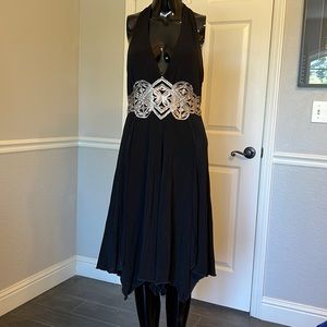 Bebe black halter dress, fully lined, stretchy, leather design on front